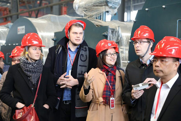 What role does a servo motor play in a burner